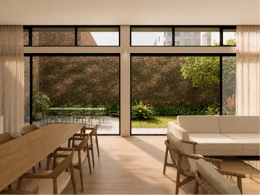 Open-plan dining and living area opening onto a courtyard