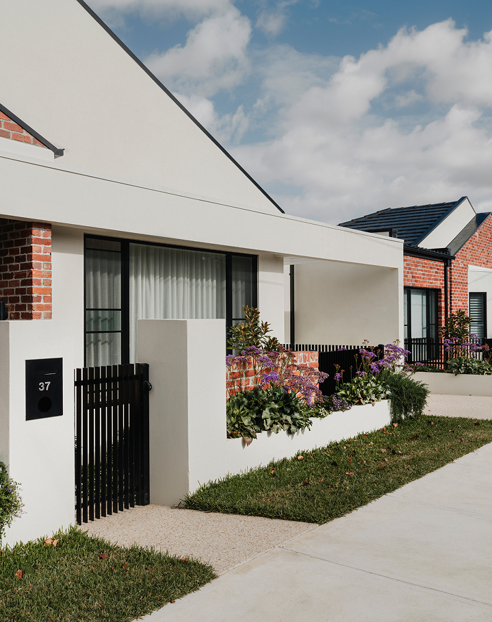 Private courtyard with outdoor seating beside a Derby Street home